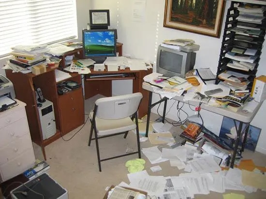 This client's home office had actually overflowed onto the dining room table. The complete office make-over included floor-to-ceiling bookshelves and closet (not shown).